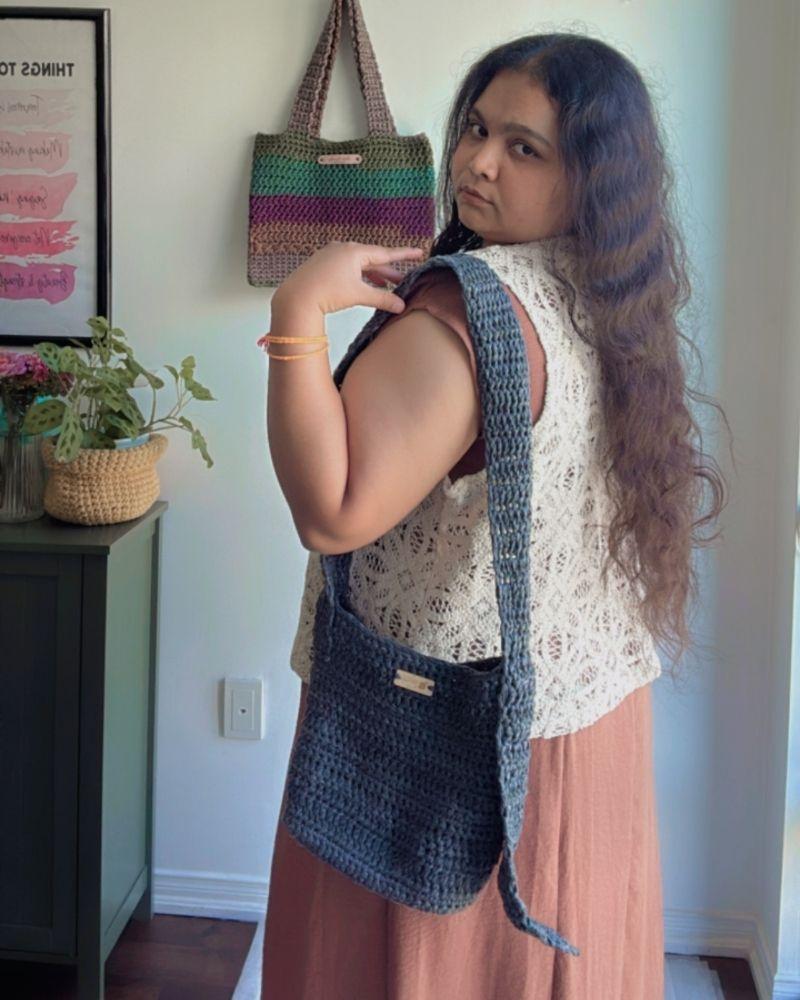 Woman holding a chic crocheted bag indoors, Gray