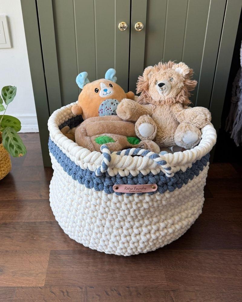 White woven basket on a wooden floor next to a green cabinet, Blue Off White