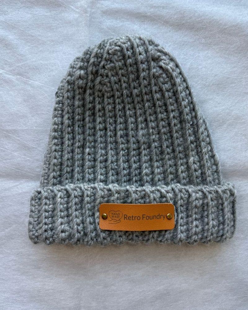 Handmade beanie with a leather patch labeled 'Retro Foundry', Gray
